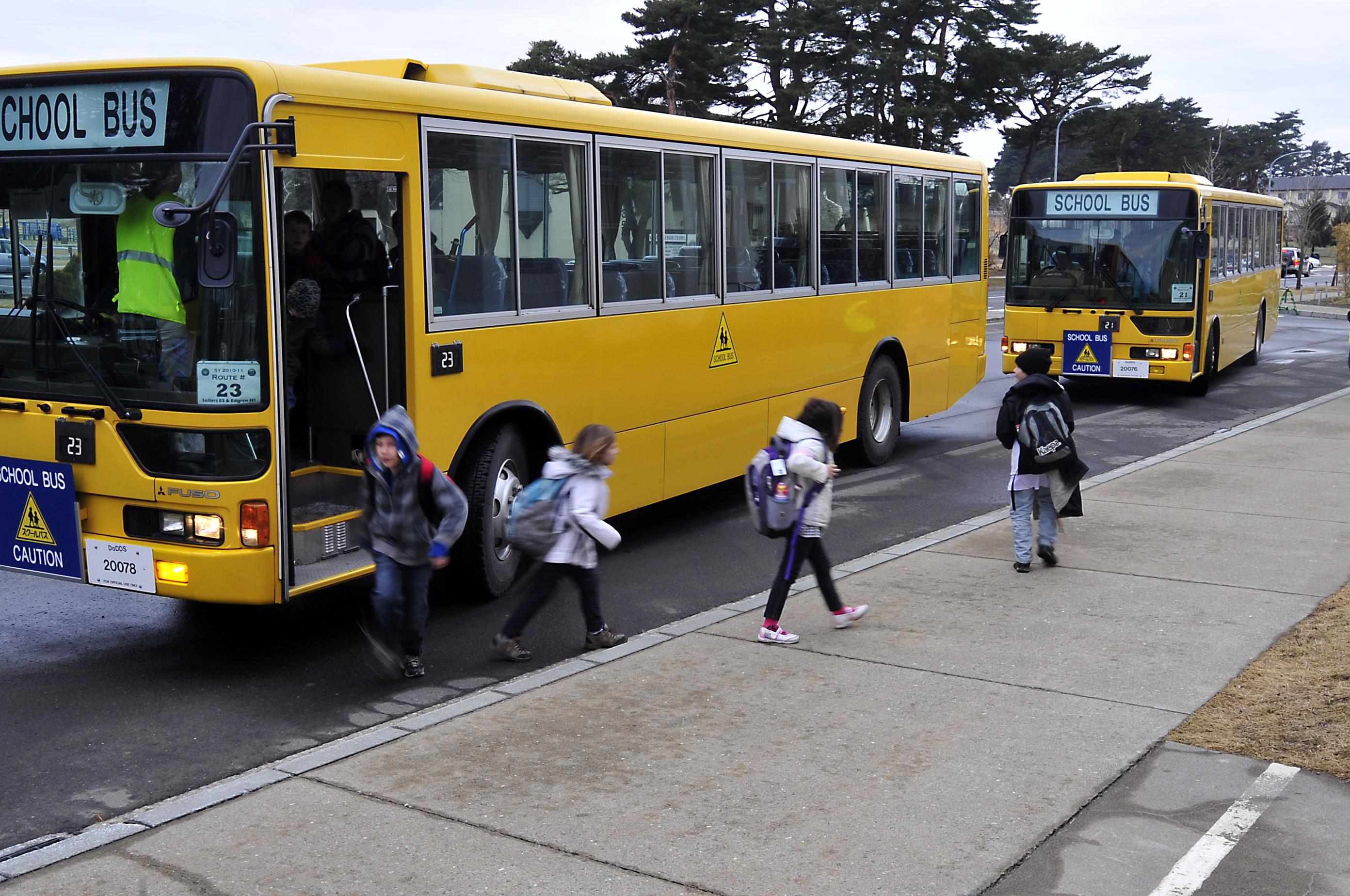 Children exiting school bus at school